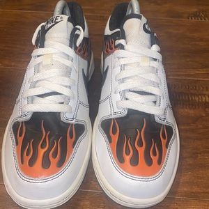 Throwback Nike Dunk Lows with flame design.